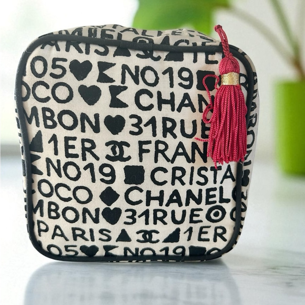 Chanel Rue Cambon Ivory with Black lettering cosmetic Case Red Tassel Authentic